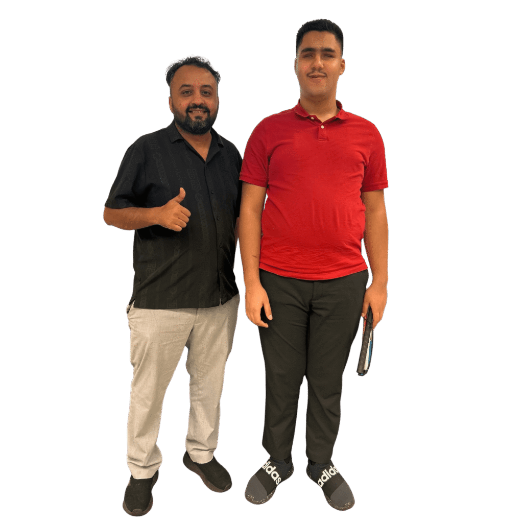 An image of young male from our Teen Transitions program and his father.